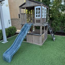 KidKraft Cliffbrook Wooden Outdoor Two Story Playhouse With Slide 