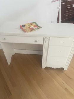 White Vanity And White Mirror 