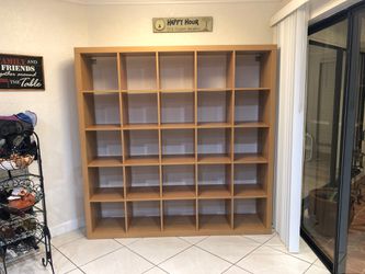 Shelf with 25 sections. 73 inches height x 73 inches wide x 16 inches depth