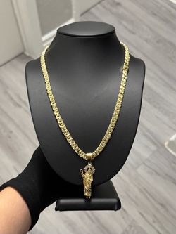 chino link chain with a San Judas Pendant
