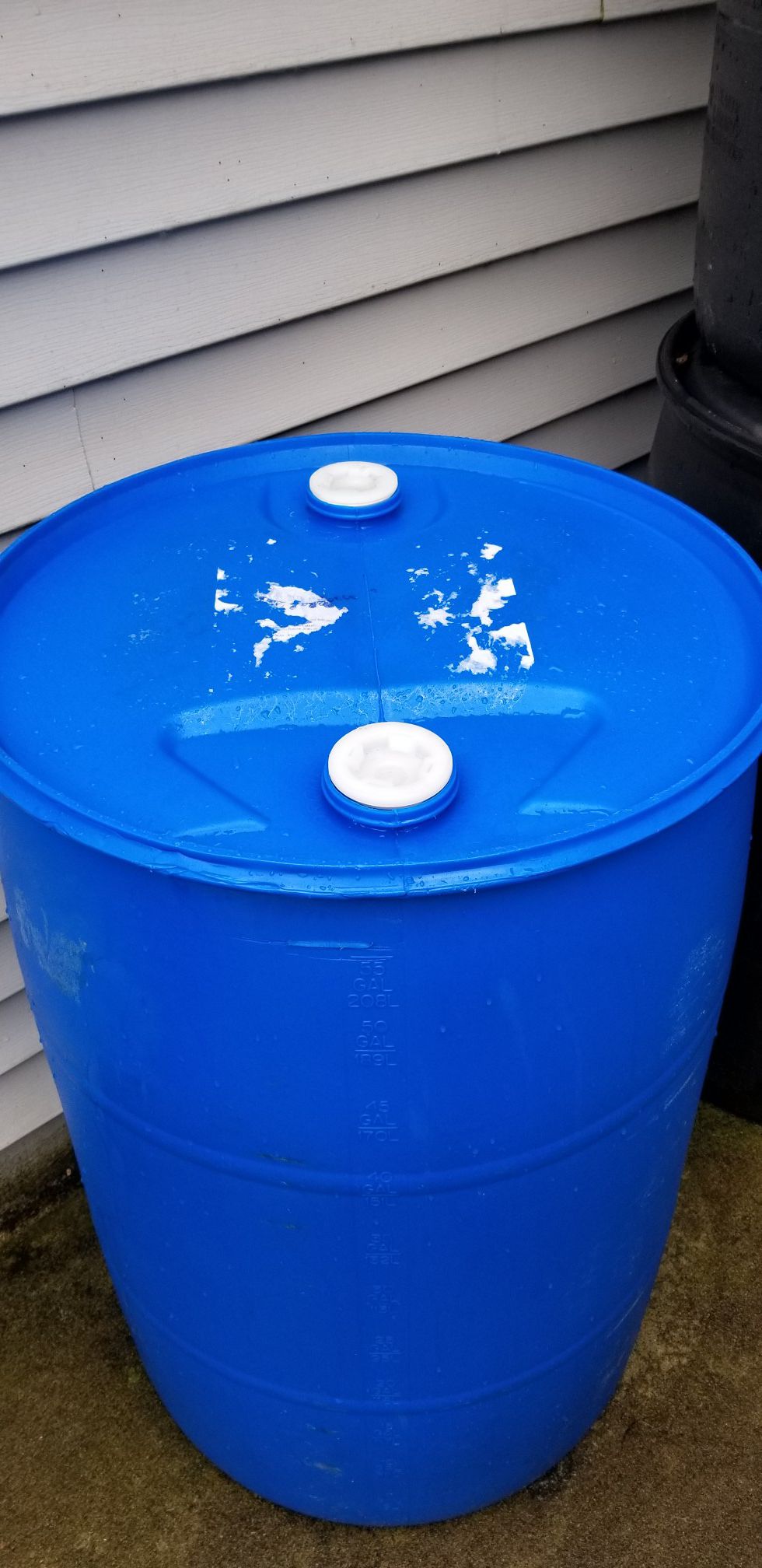 Plastic 55 gallon drum barrel.