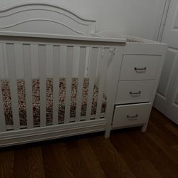 mini white crib with changing table