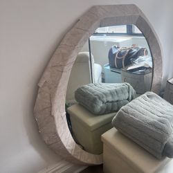 large antique marble mirror (covered in wallpaper due to marble damage)