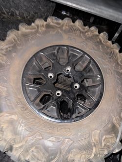 Selling  OEM Can-Am Maverick X3 wheels with Maxxis Carnivore tires.