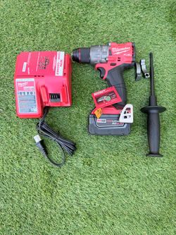 Milwaukee Hammer drill with batter and charger