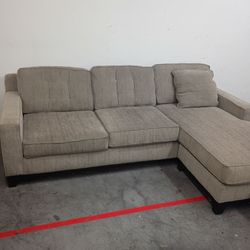 Small brown l-shaped sectional couch