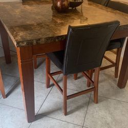 Sturdy Marble Table With Four Chairs For $125.00 