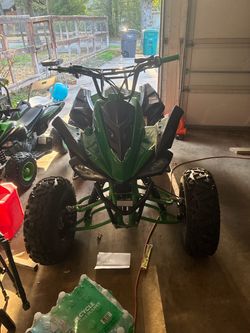 Green and Black  ATV Four Wheeler reposting wife marked as sold when I was trying to lower price
