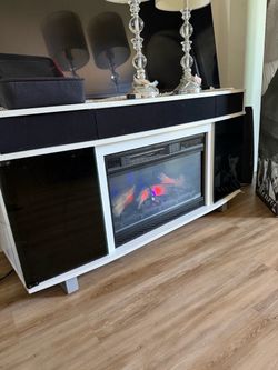 media console with an electric fireplace
