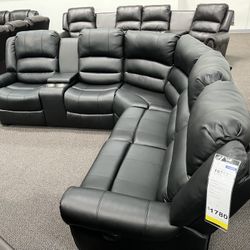 New Reclining Sectional .  Black Leather .  111” X 98”.  Free Delivery !