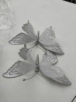 Silver glitter mesh butterfly ornaments.