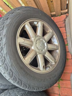 GMC 275/60R20 used tires and rims.