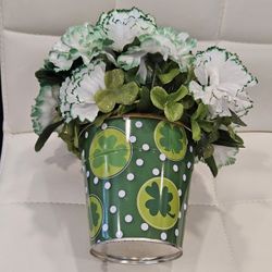 St. Patrick's Day themed artificial flower arrangement in a festive metal pot. 8 inch tall