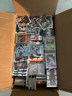 Box full of sports cards and some pokemon cards in there