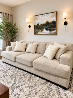 Large Beige Sectional Sofa with Cushions