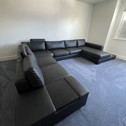 Modern Black Leather Sectional Sofa with Light