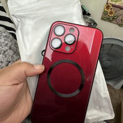 Brand new iPhone 15 Pro Max, red and black phone case
