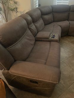 Brown sectional and love seat recliner
