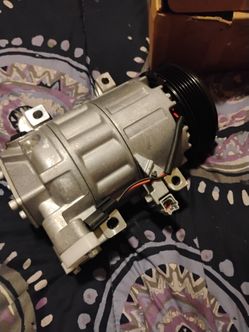 brand new ac compressor and throttle body for a 2014 Nissan Altima
