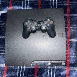 ps3 with a controller and a cable 