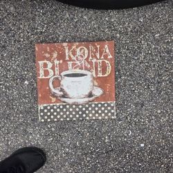 Rustic, coffee-themed wall art featuring a distressed "Kona Blend" design and polka dot accent. Perfect for a home coffee bar or kitchen.