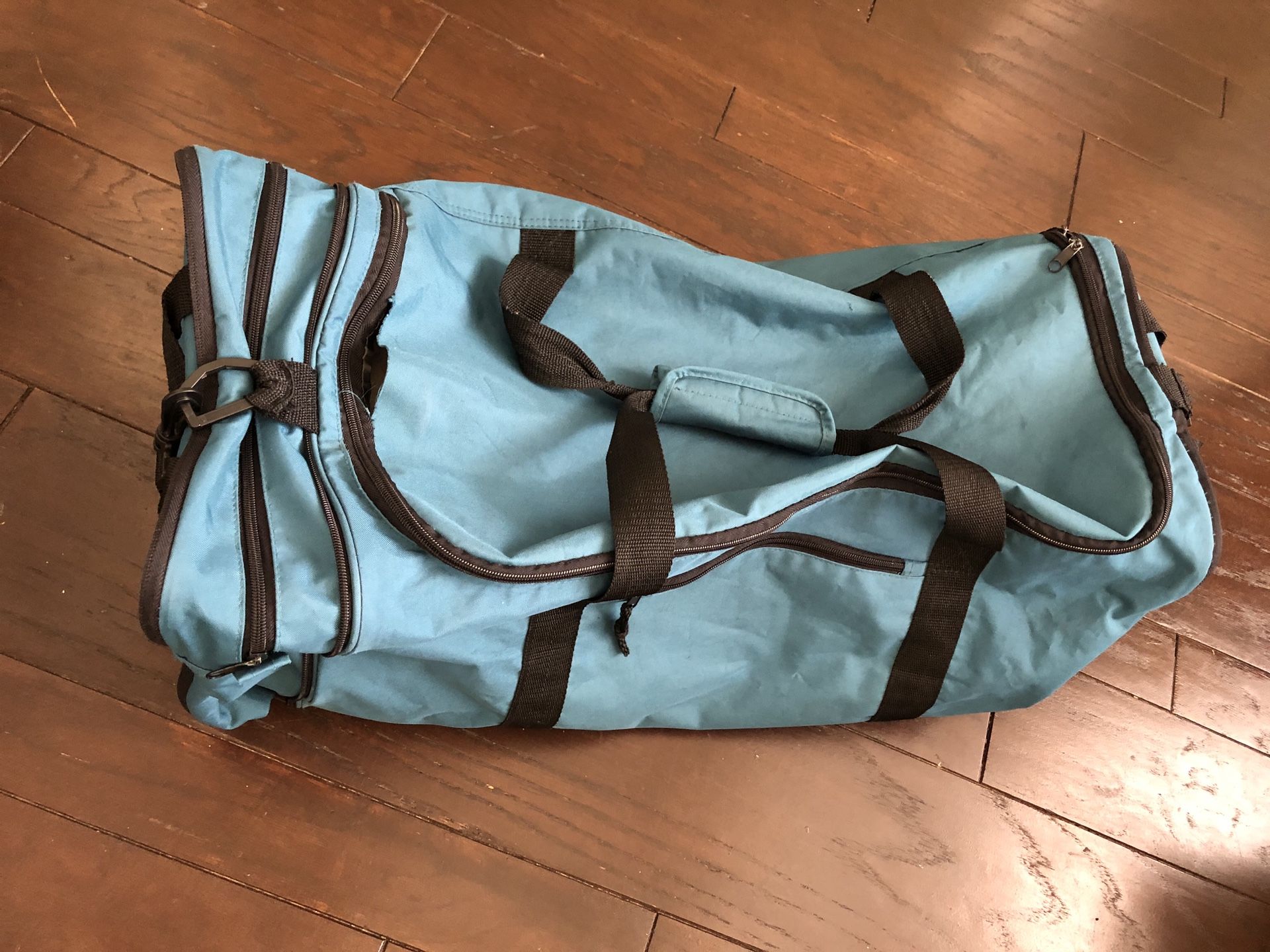 Protege Sports Large Green Duffle Bag 27 inches long x 12 inches tall x 11 inches wide - Used with minor rips and tears