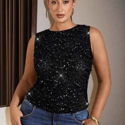 Black sequin top with sparkly details.