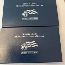 2 Lewis And Clark Commemorative Silver Dollars