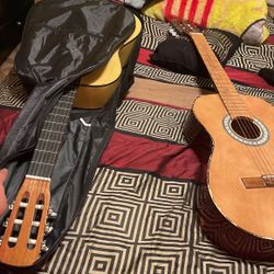 2 Acoustic Guitars; One Is A Little Scratch Other Is Completely New 