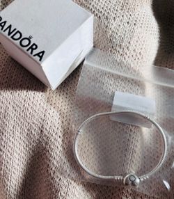 Pandora bracket and cross charm