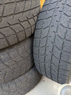 Bridgestone Blizzak WS70 Snow Tires 205/55R16 On Black Steel Rims Thumbnail