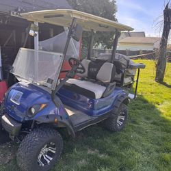 Blue  2014 Electric Yamaha Golf Cart w/ Lift Kit