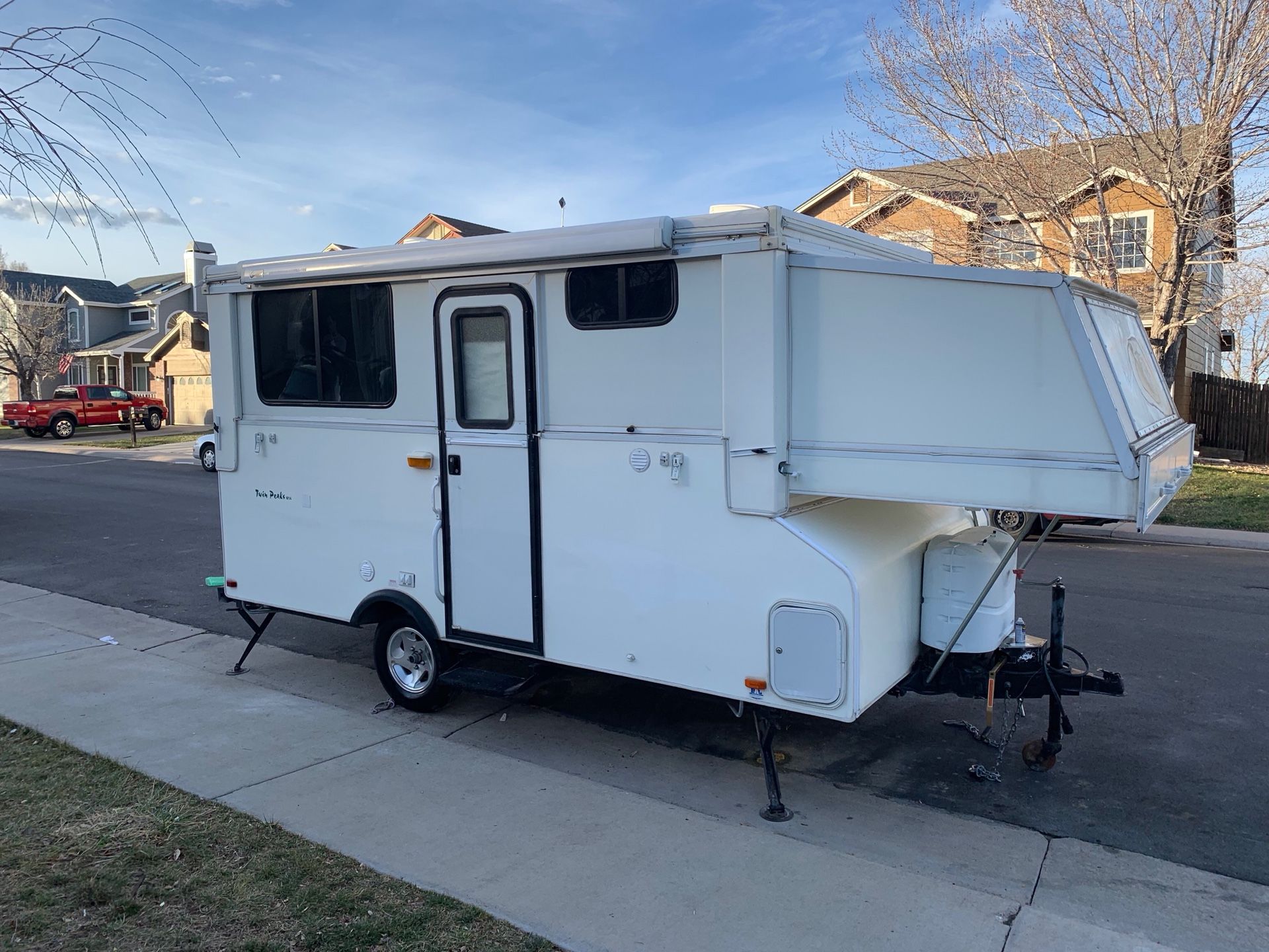 2005 Base Camp Twin Peaks pop up Trailer model number M14 14ft Sleeps 5 Fully self contained roll out awaing stove ice box stove bathroom shower Ex