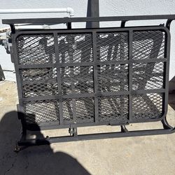 Hitch mounted wheelchair carrier with ramp