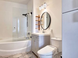 H Frameless Wall Hinged Tub Door in Matte Black with Clear Glass 34 in. W x 58.25 in.