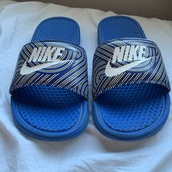 Blue Nike slides