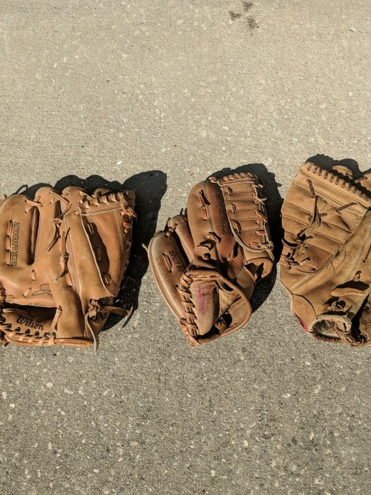 Three Baseball Gloves In Great Shape