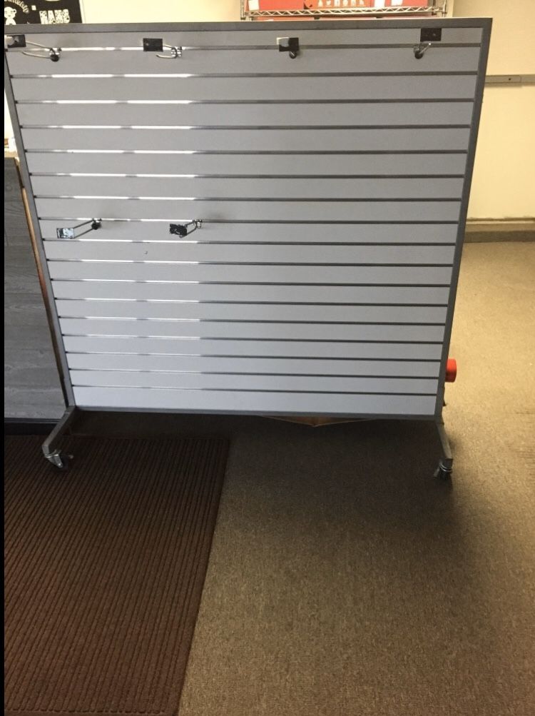 Slate display with metal hooks, it's on wheels, 2 sided