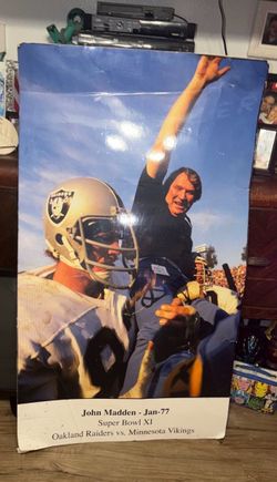 Preowned approximately 56x32 in size poster of Head coach John Madden celebrating the Oakland Raiders victory in Super Bowl XL. This is a giant photo