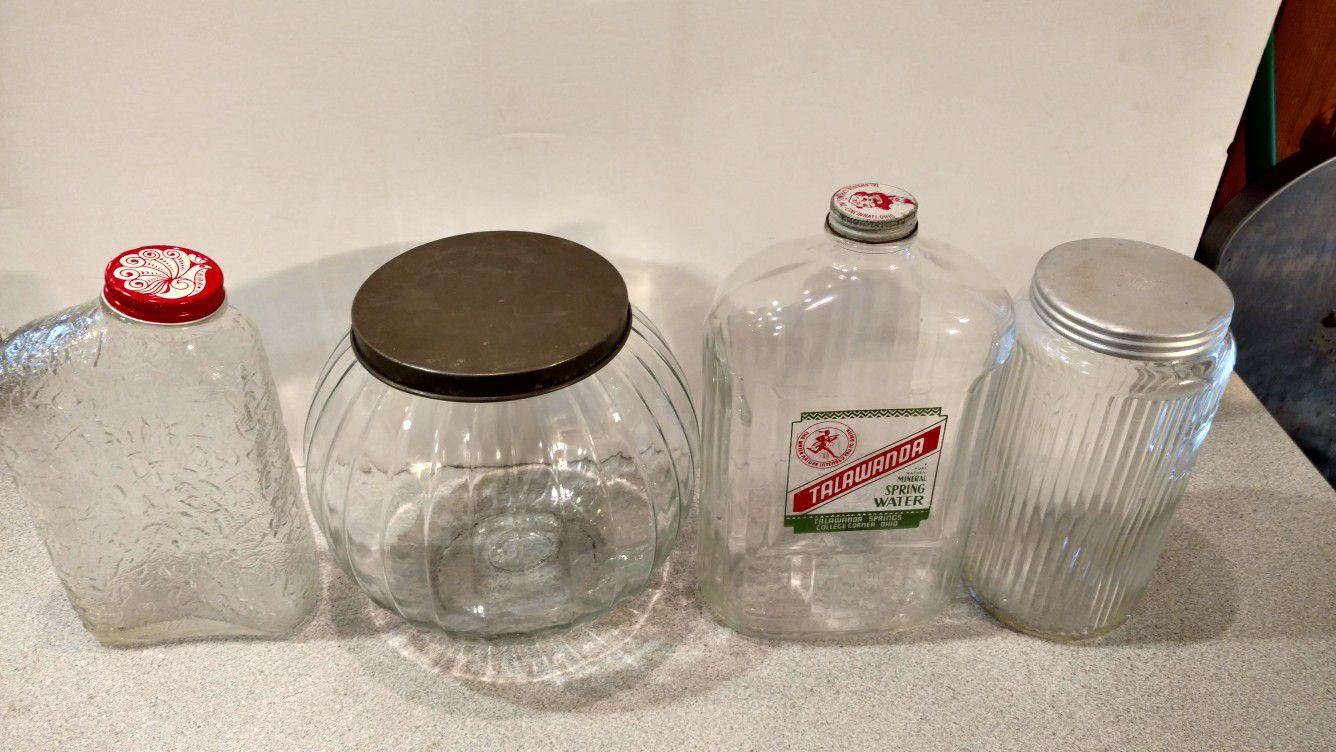 4 Vintage glass jars.