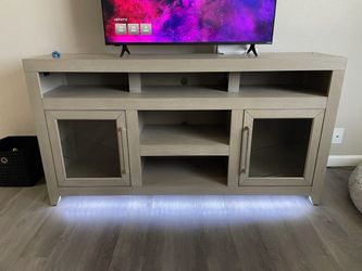 Entertainment stand for TV and two end tables in a coffee table