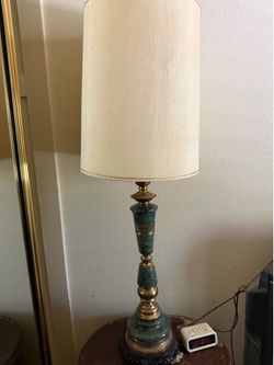 Vintage green marble and brass table lamp features a slender, neoclassical design with a fabric drum shade