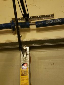 BROKEN SPRINGS OR FLIPPED CABLES GARAGE DOOR