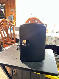 The Personal Chiller mini-fridge, model K4105MTBK, is a compact 4-liter portable cooler and warmer, designed for small spaces, dorm rooms, offices, or