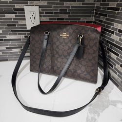 Coach Tatum Carryall in Signature Canvas.