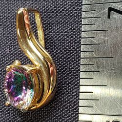 14k Yellow Gold Slide/Pendant with an oval cut Caribbean Sunset Topaz