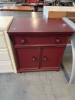 Small red maroon cabinet or nightstand (in store)