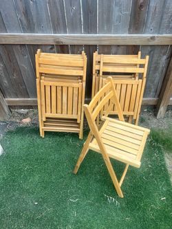 8 Outdoor Wooden folding chairs ( used)