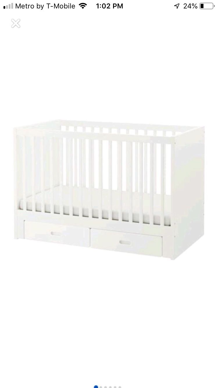 Ikea baby crib with 2 bottom green drawers