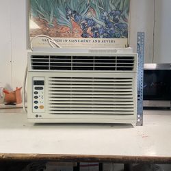 an LG Used Perfectly Working LW6012ER 6,000 BTU Window Air Conditioner. 